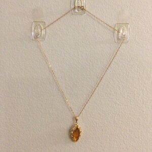 2/$15 Item 11 Necklace 16 ingold tone chain with faux amber and diamond pendant